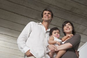 Hispanic family with baby planning taxes